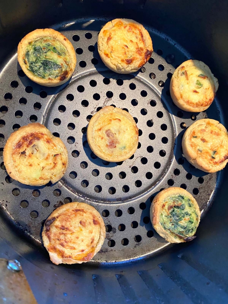 close up of miniature quiches in the air fryer cooking