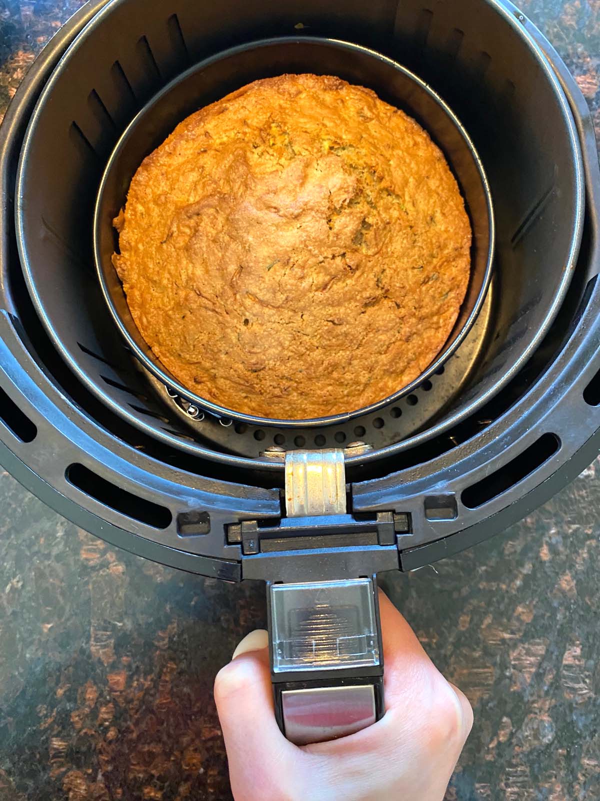 A freshly baked air fryer zucchini bread in the air fryer.