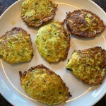 Zucchini pancakes on a plate.