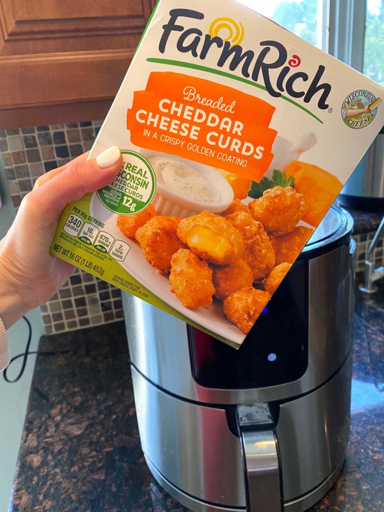 pack of frozen cheese curds in front of air fryer