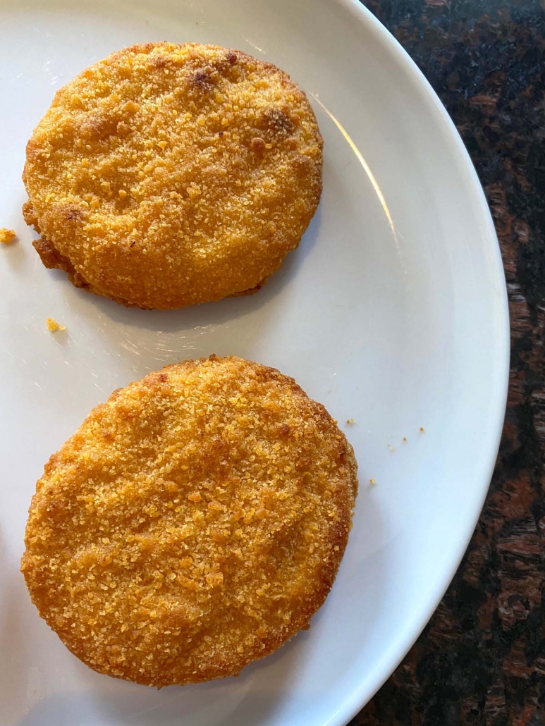 cooked breaded chicken patties on a plate