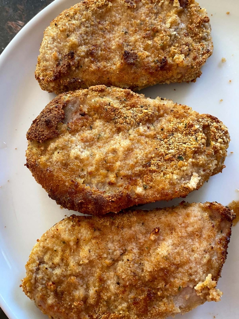 breaded pork chops plated