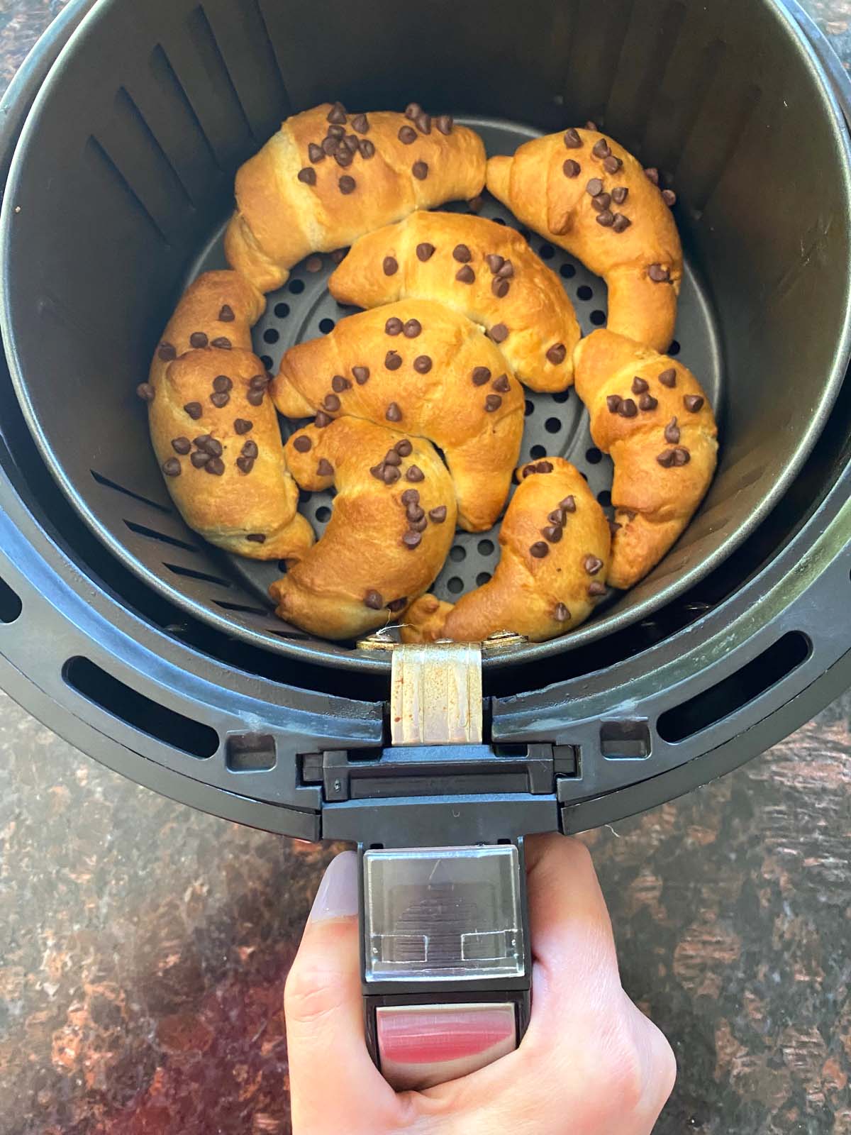 Chocolate croissants in an air fryer.