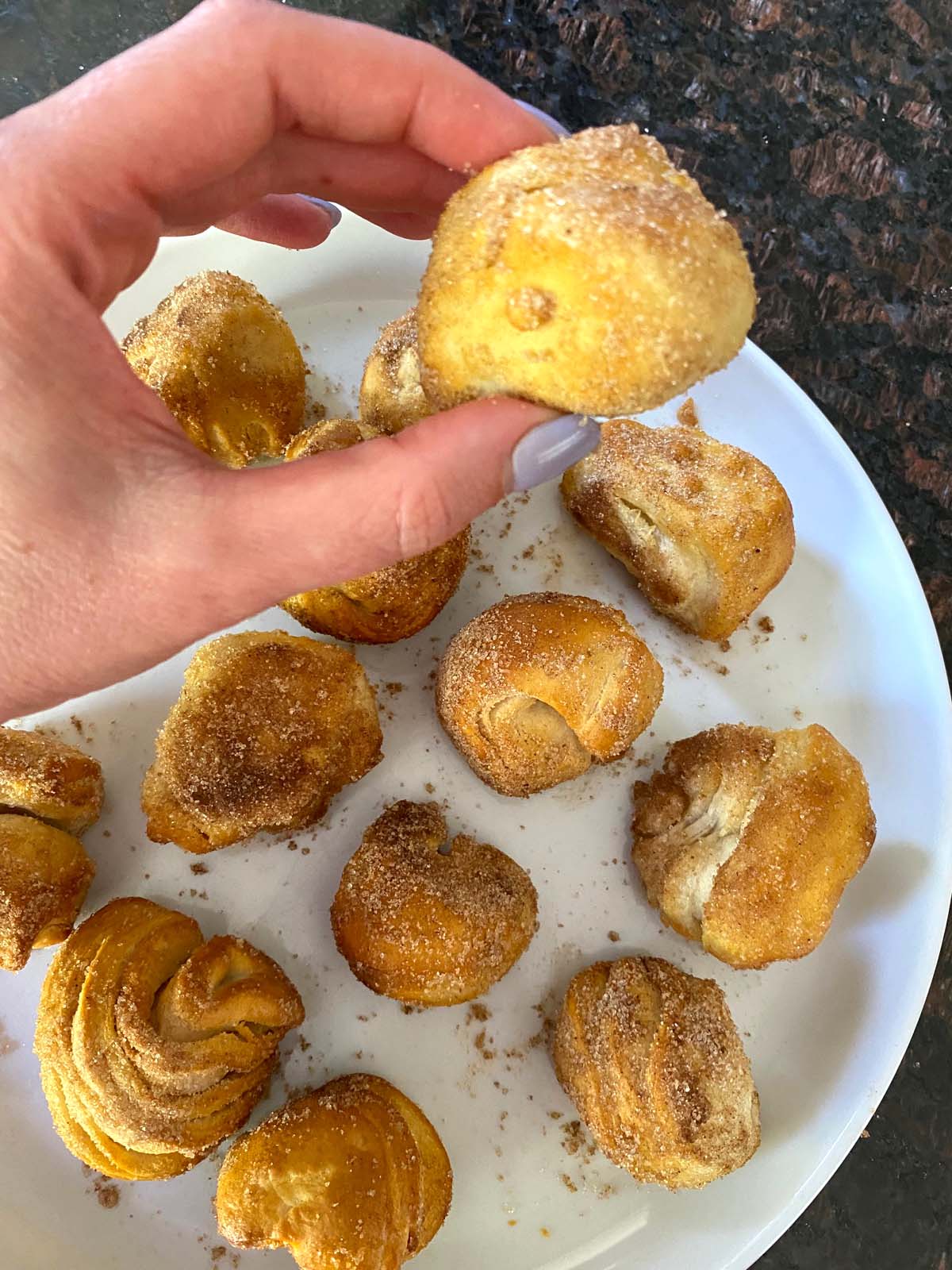 Donut holes on a plate.