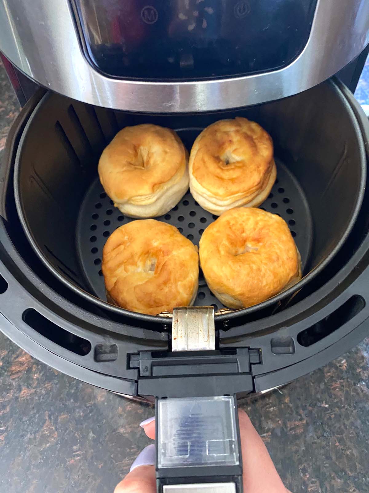 Biscuit donuts in an air fryer.