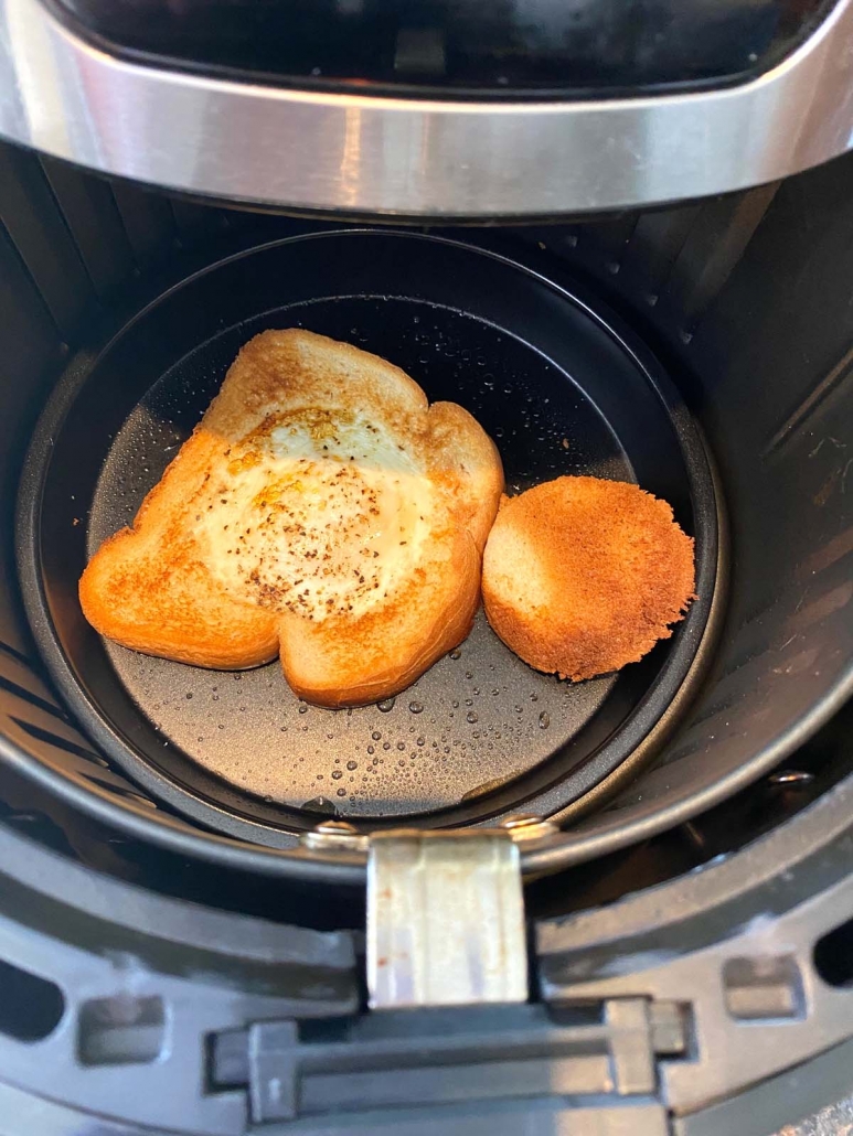 egg in a hole toast cooking in the air fryer