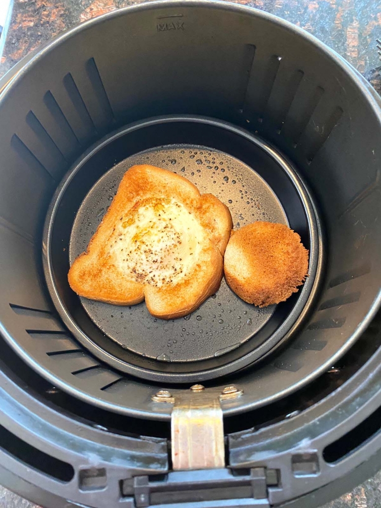 toast with egg in a hole cooking in the air fryer