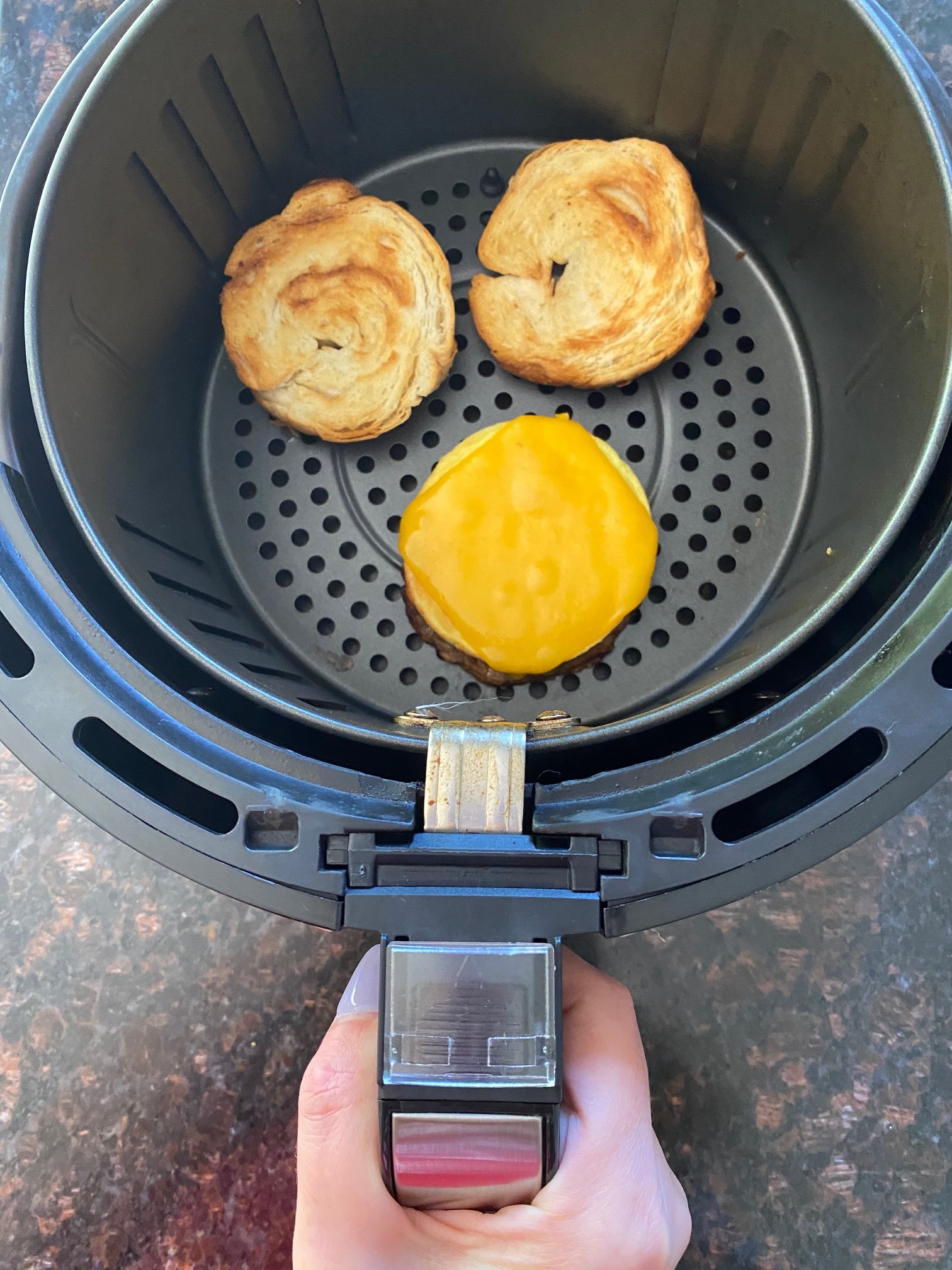 Breakfast croissant in an air fryer.
