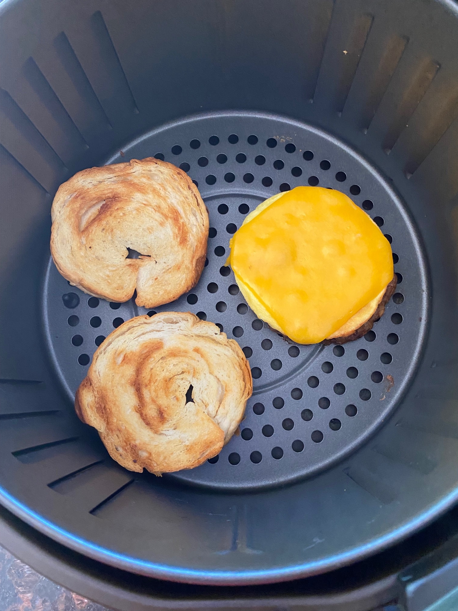 Breakfast croissant in an air fryer.