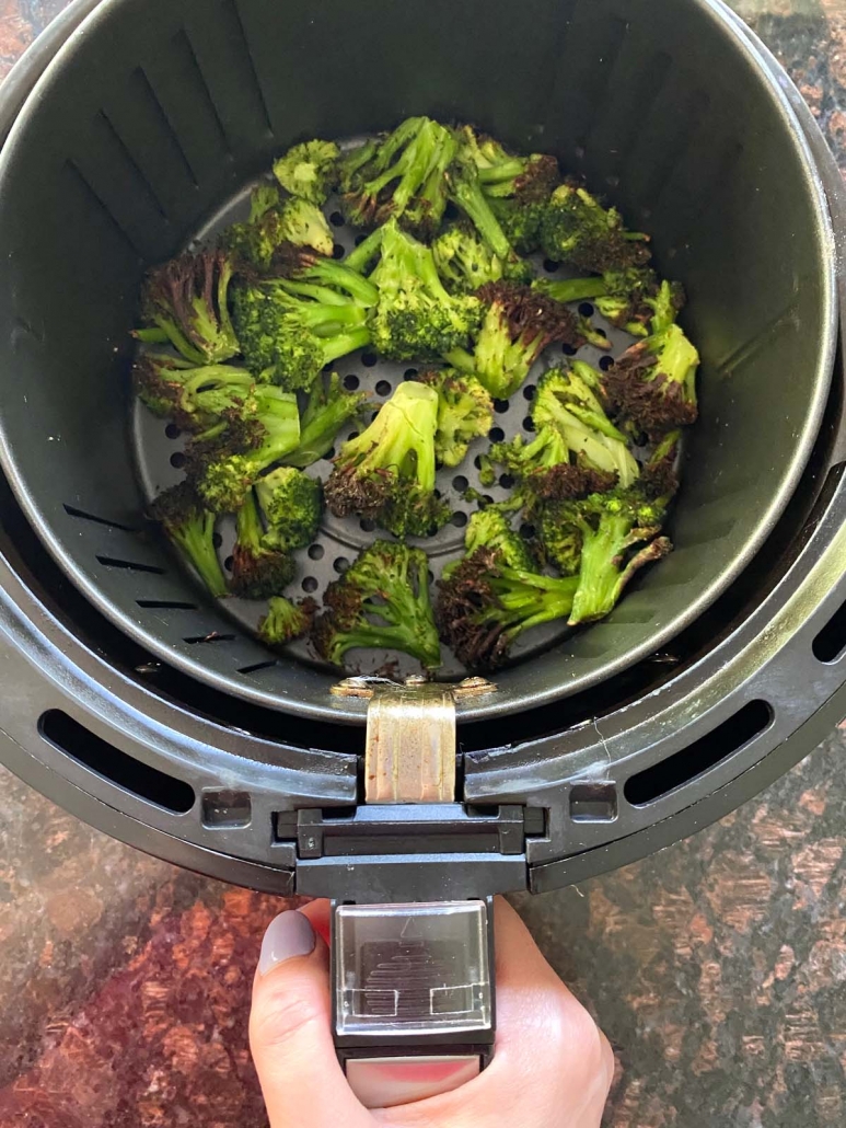seasoned, cooked broccoli in air fryer basket