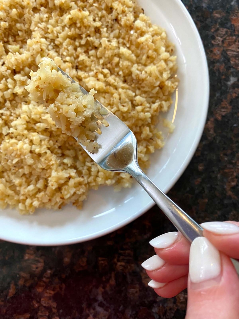 forkful of cooked cauliflower rice