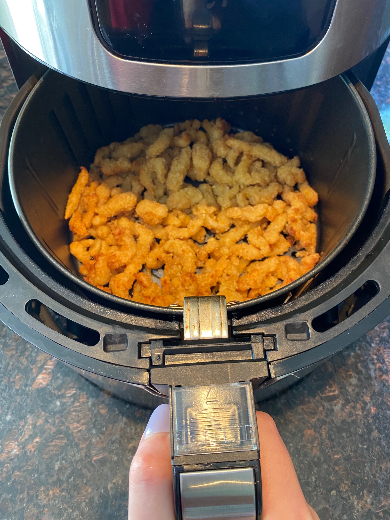 Clam strips in basket after cooking.