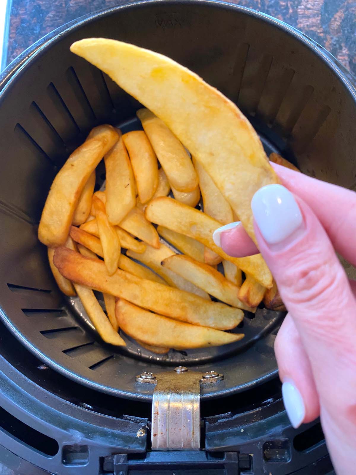 Cooked steak fries in an air fryer. 