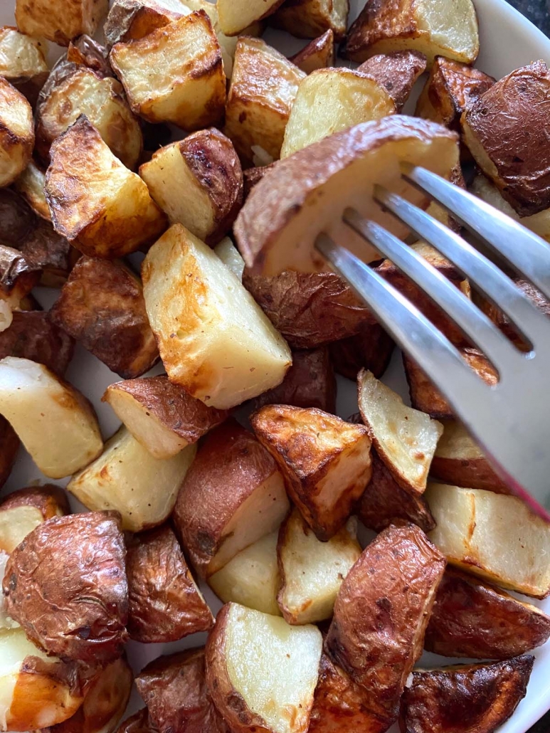 fork piercing piece of potato