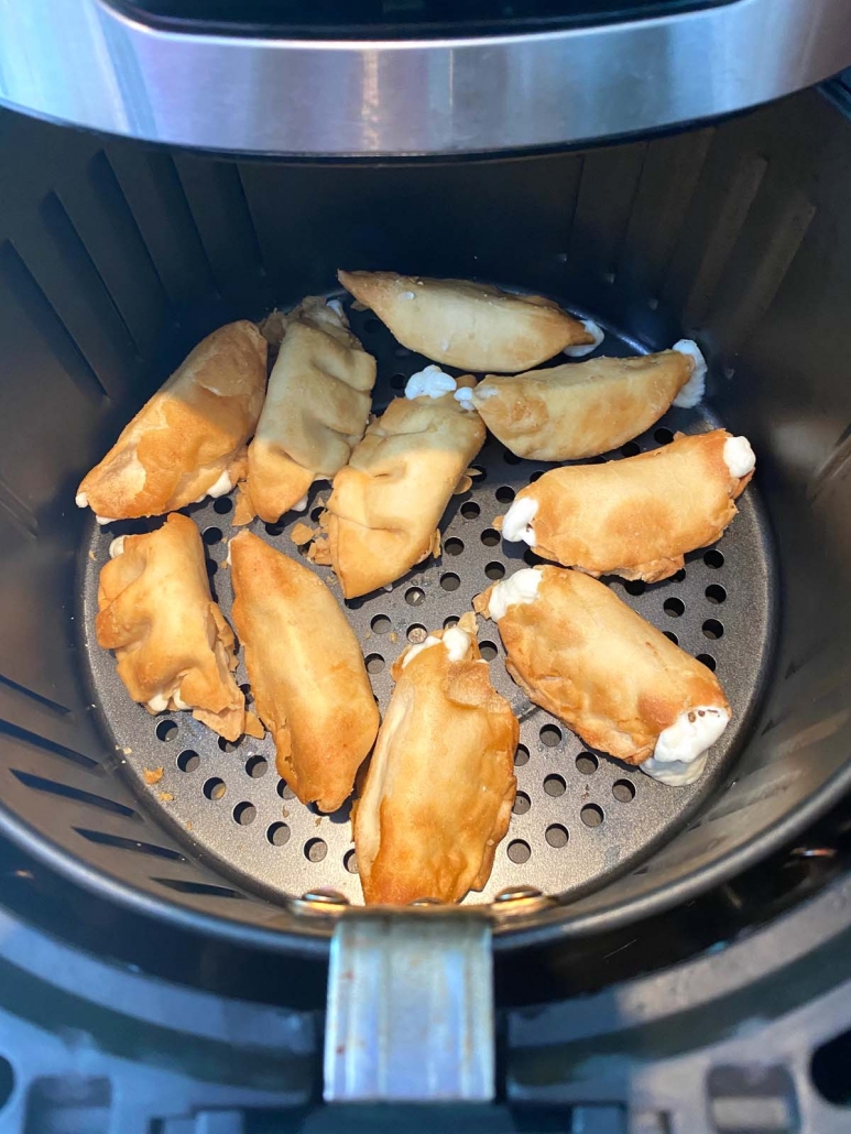 overhead shot of air fried cream cheese wontons in the air fryer