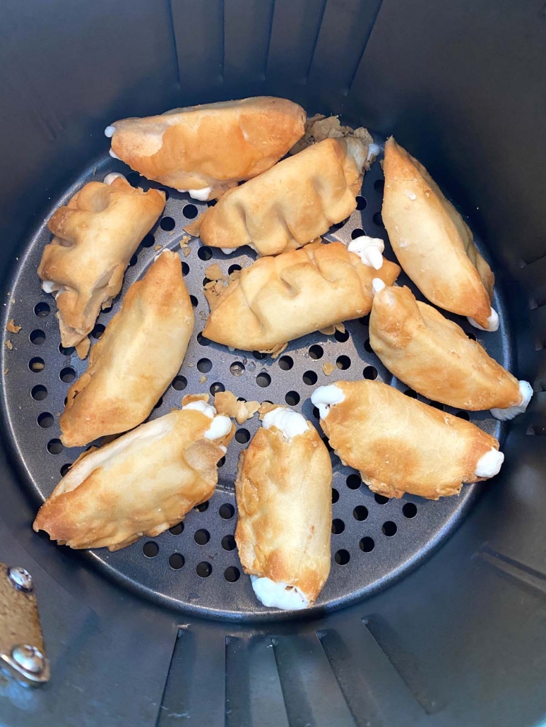 close up overhead view of air fried cream cheese wontons in the air fryer