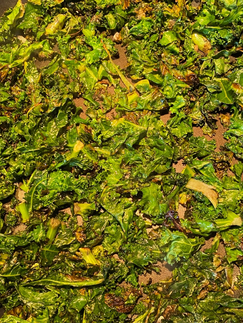 close up of kale sautéing in frying pan