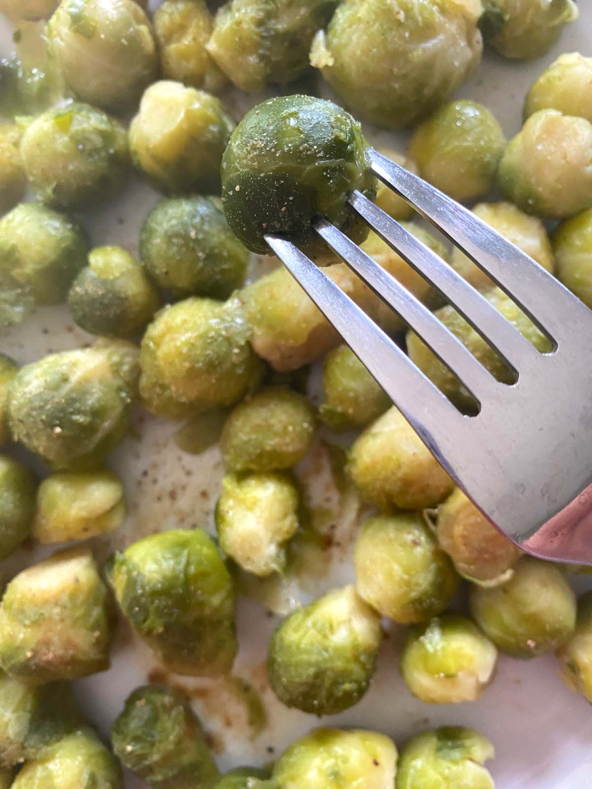 Cooked brussels sprouts on a plate.