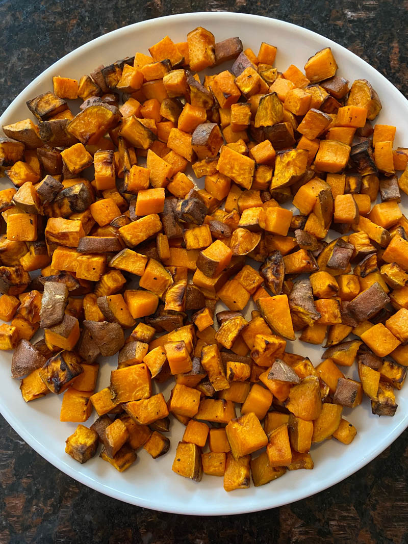 Plate of cooked diced sweet potatoes.