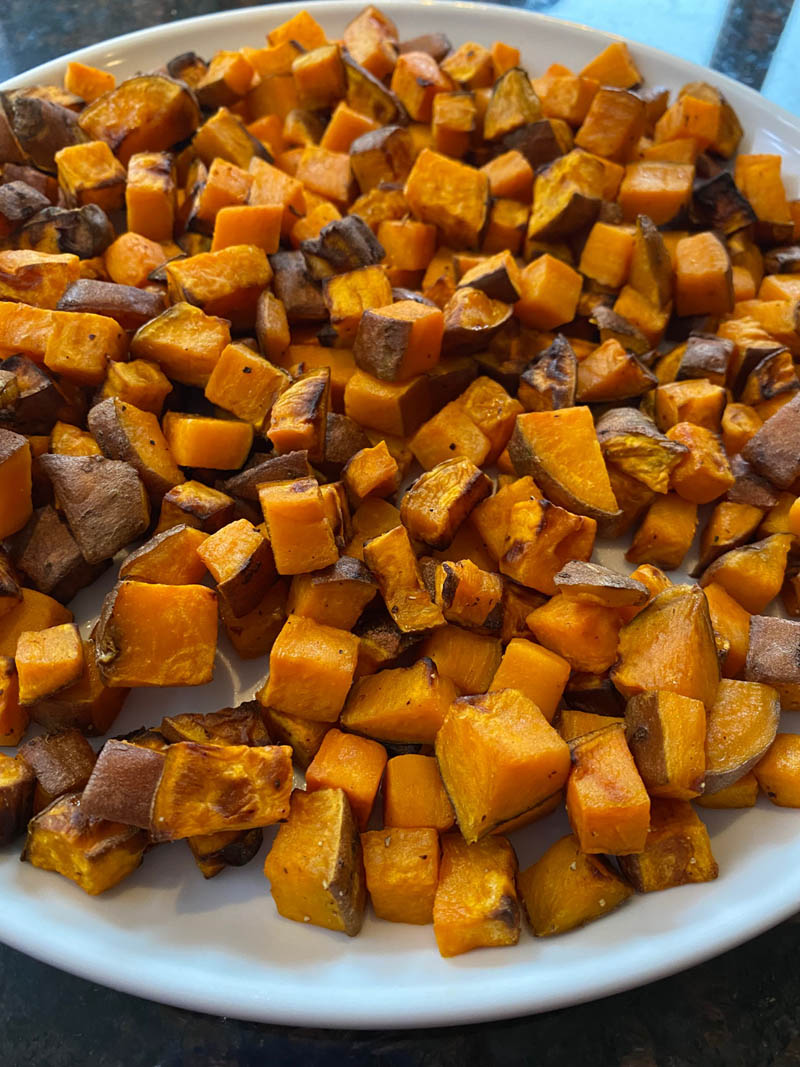 Plate of cooked diced sweet potatoes.