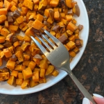 Plate of cooked diced sweet potatoes.