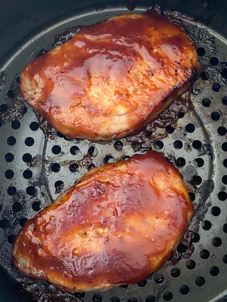 air fryer pork chops covered in bbq sauce