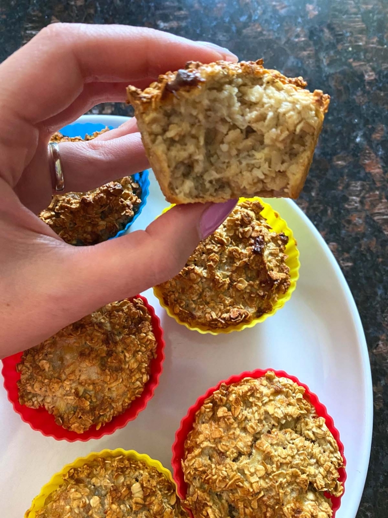 hand holding half of an Banana Baked Oatmeal Cup