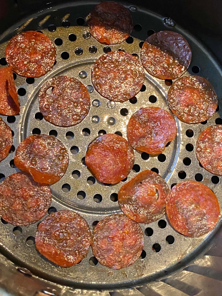 pepperoni slices at bottom of air fryer