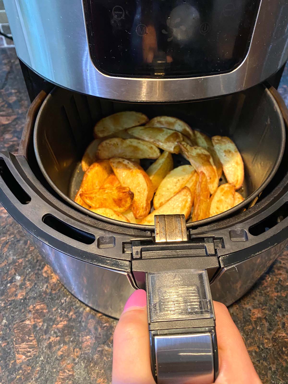 Cooked potato wedges in the air fryer.