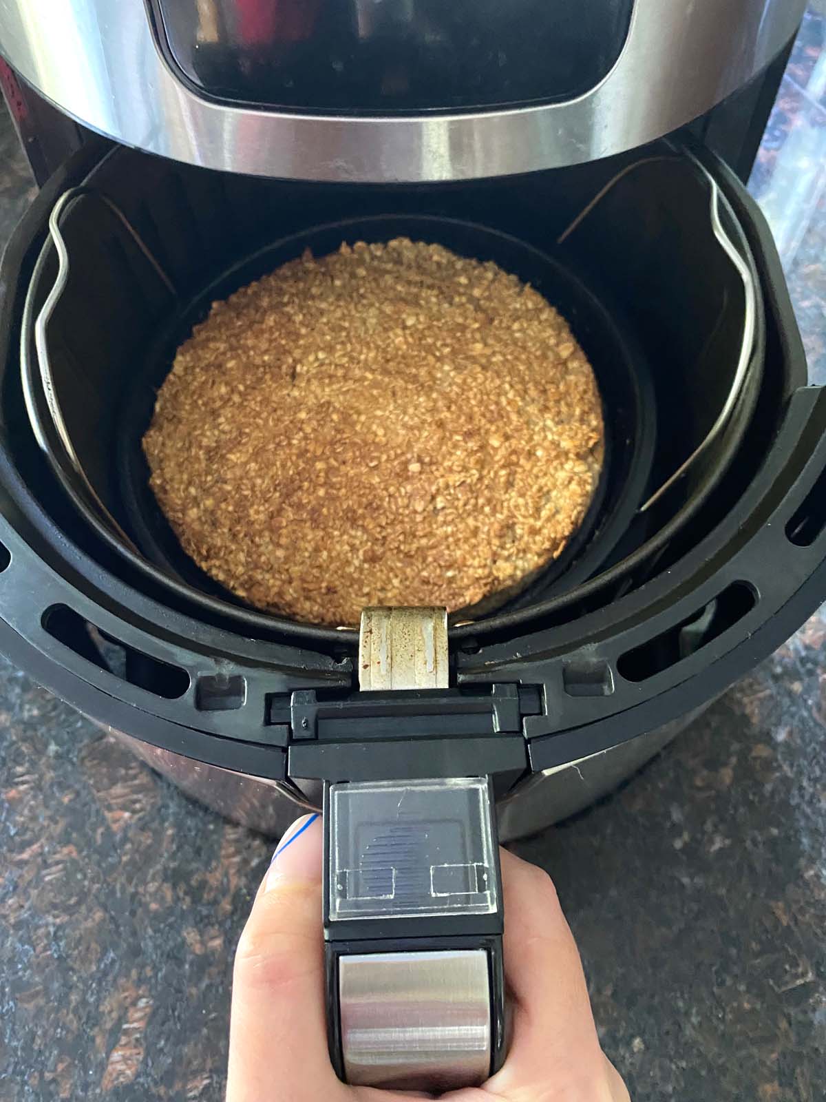 air fryer opened to show baked oatmeal 