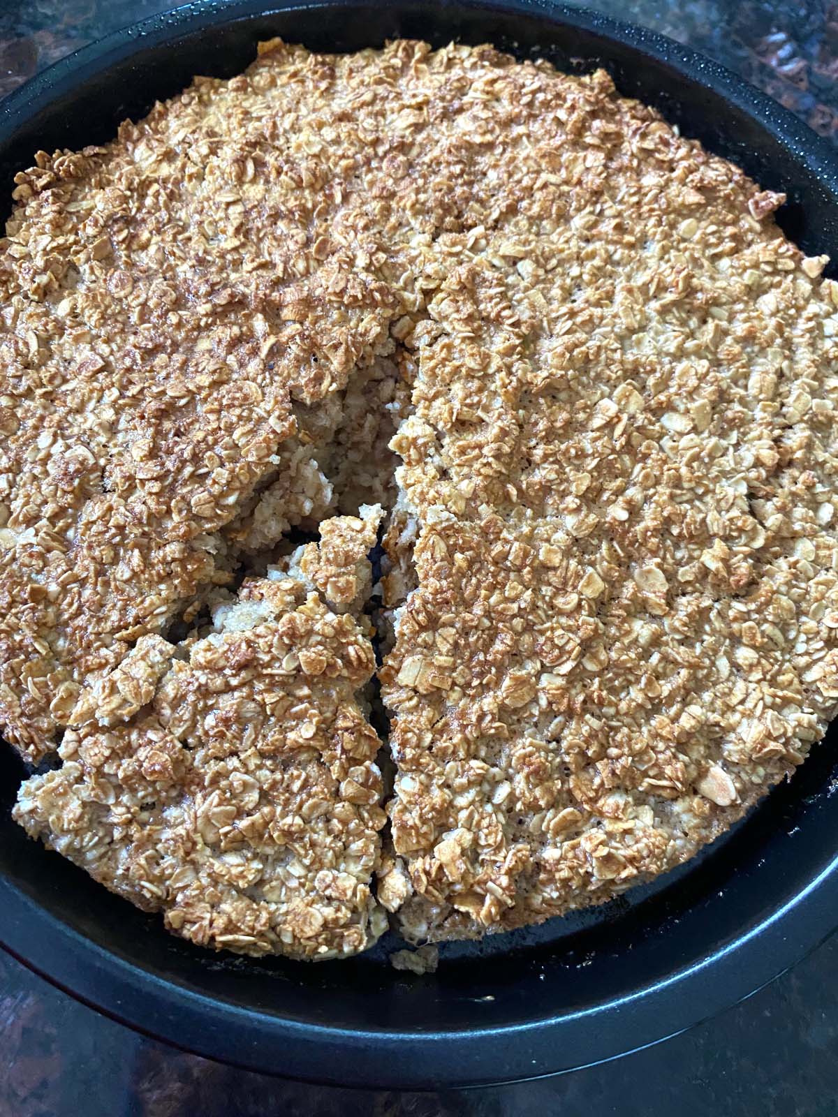 pan with baked oatmeal and one slice cut