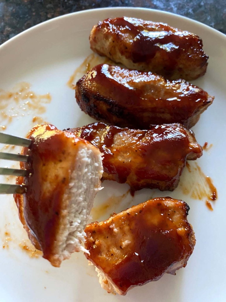 cooked pork ribs covered in bbq sauce
