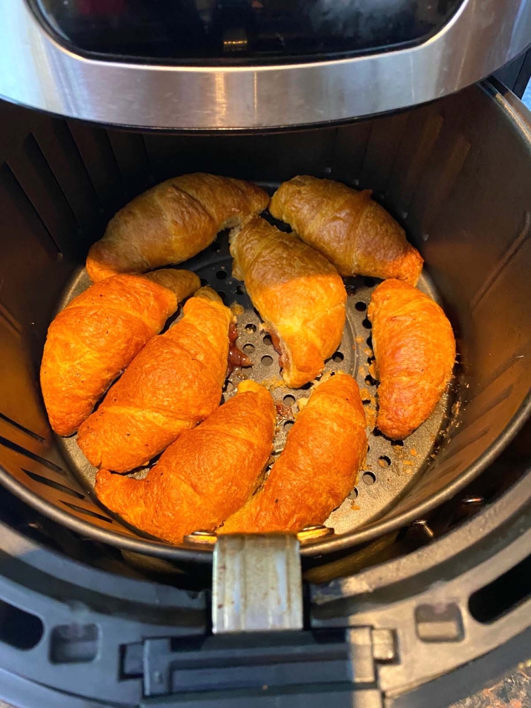 golden brown Cream Cheese Danish Crescent Rolls cooking in air fryer