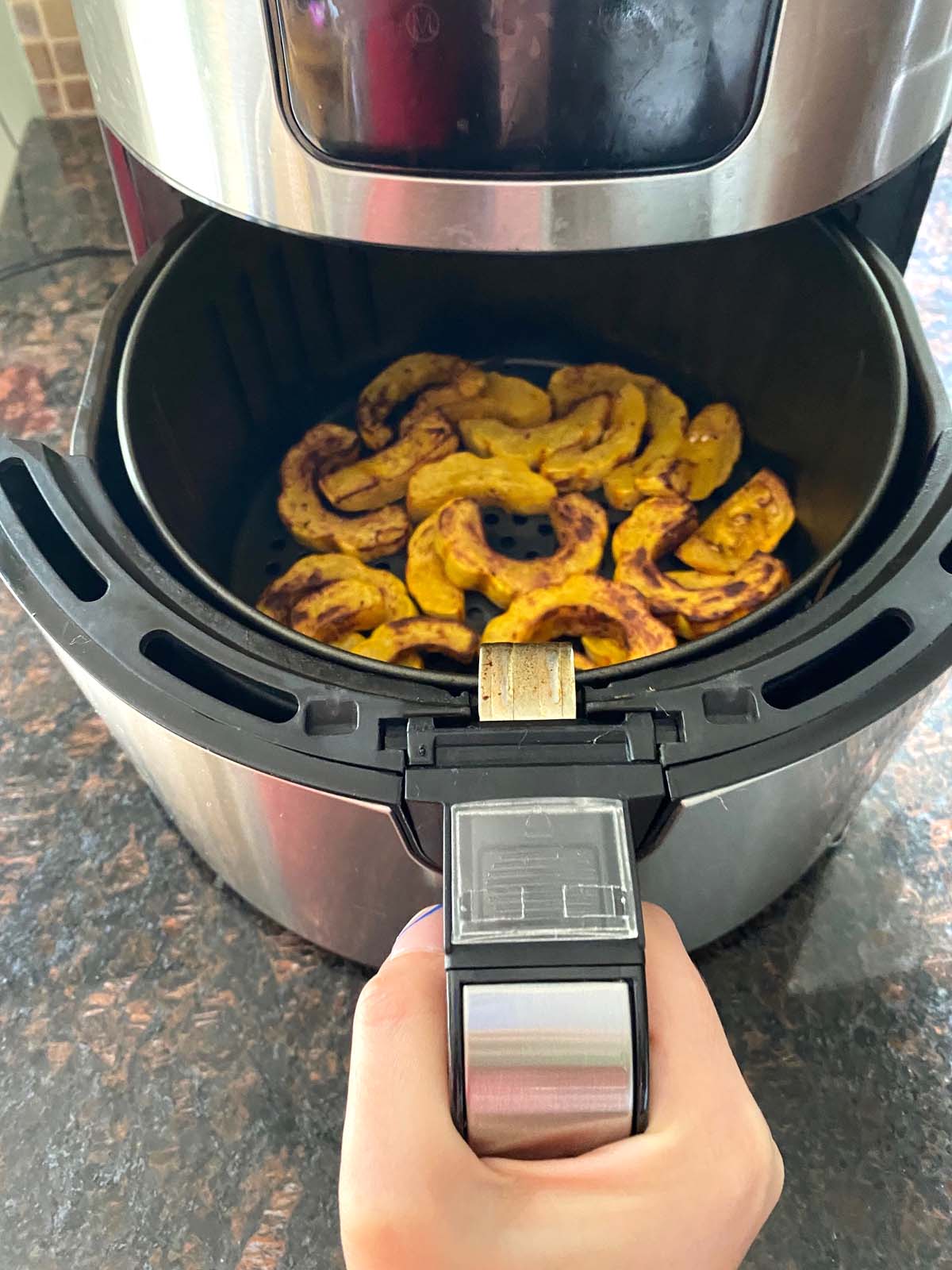 Cooked delicata squash in an air fryer.