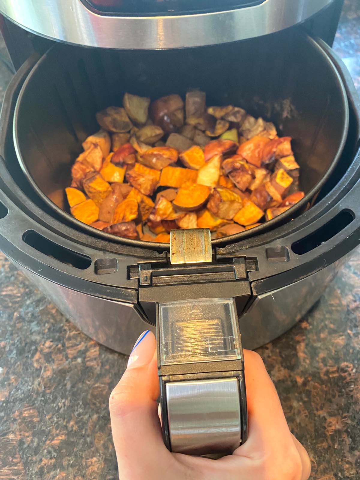 Roasted sweet potatoes and apples in an air fryer.