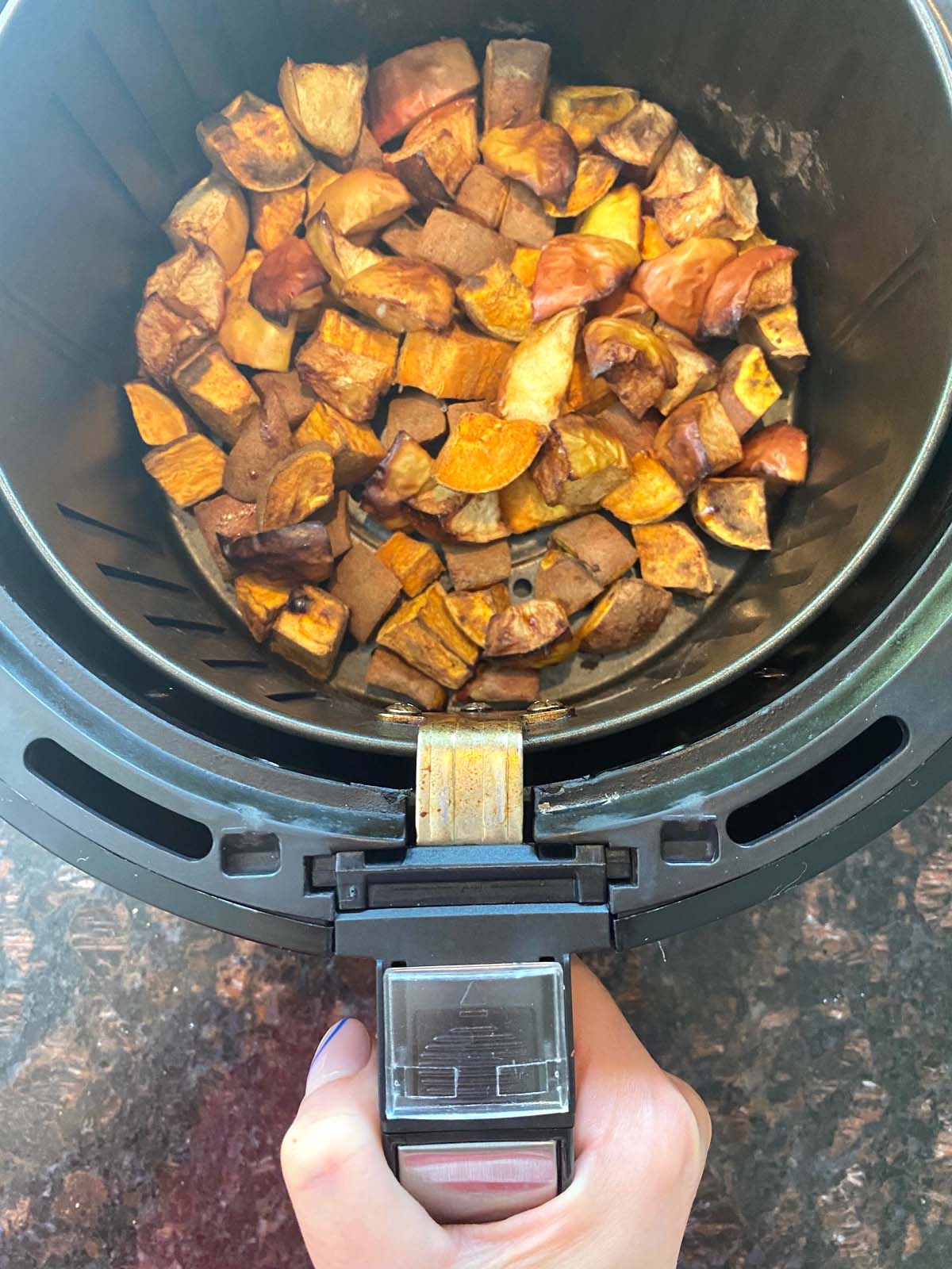 Roasted sweet potatoes and apples in an air fryer.