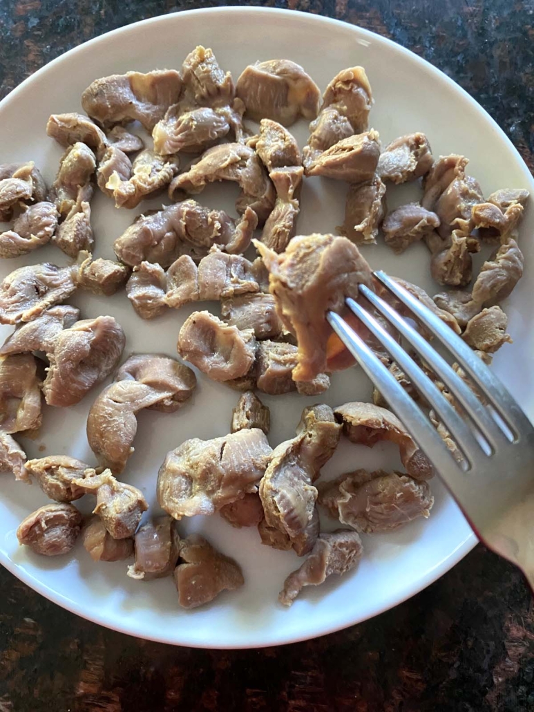 plate of cooked chicken gizzards