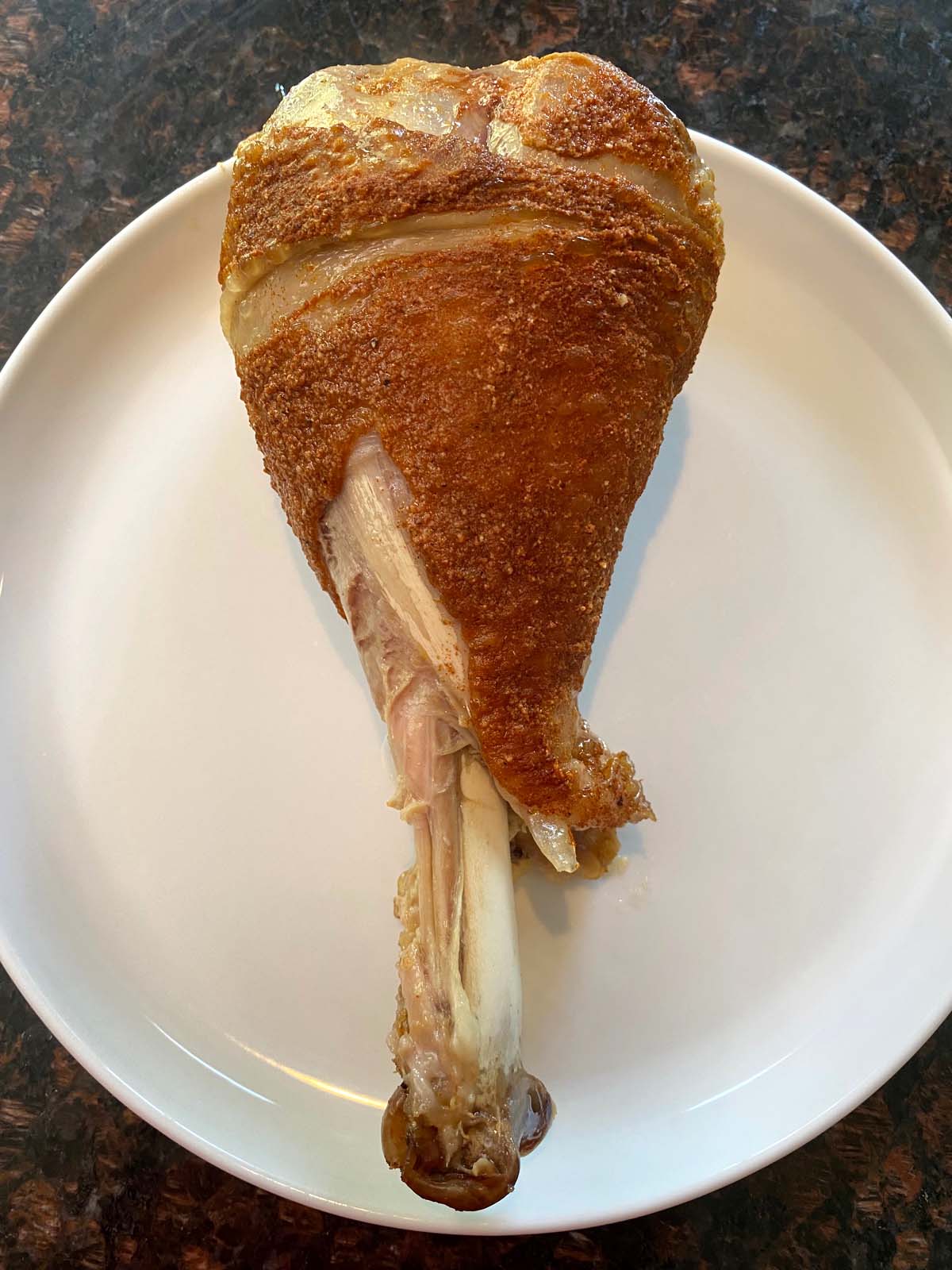 Cooked turkey leg on a plate.