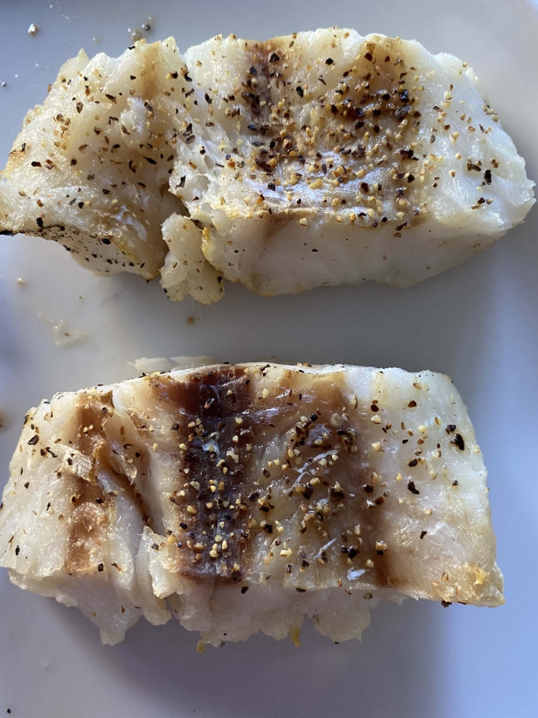 seasoned and cooked cod on a plate