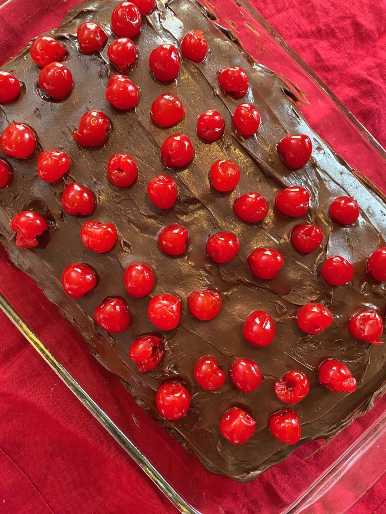 chocolate cake topped with cherries