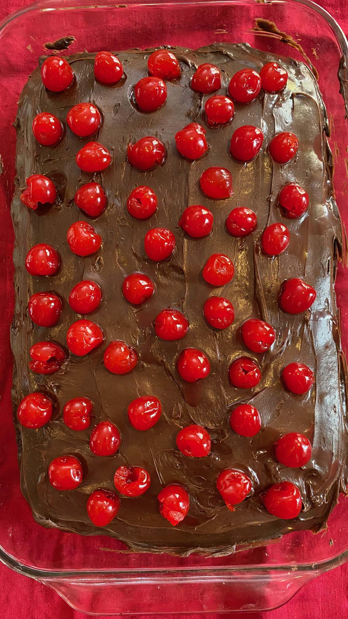 maraschino cherries on chocolate cake