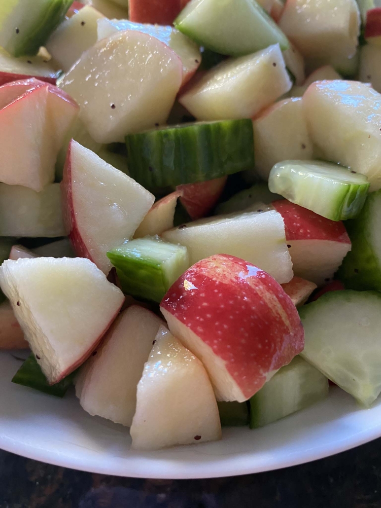 close-up of chopped apples and cucumber