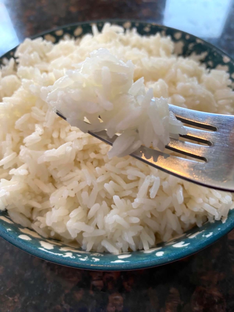 cooked jasmine rice in a serving bowl