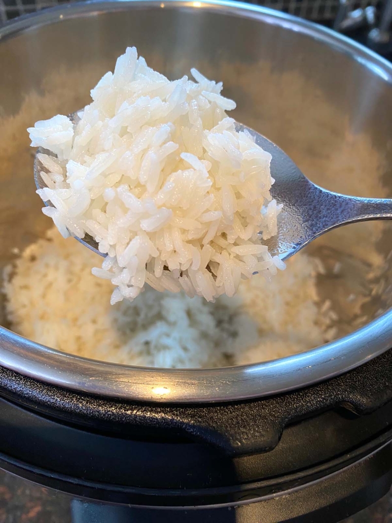 forkful of cooked jasmine rice