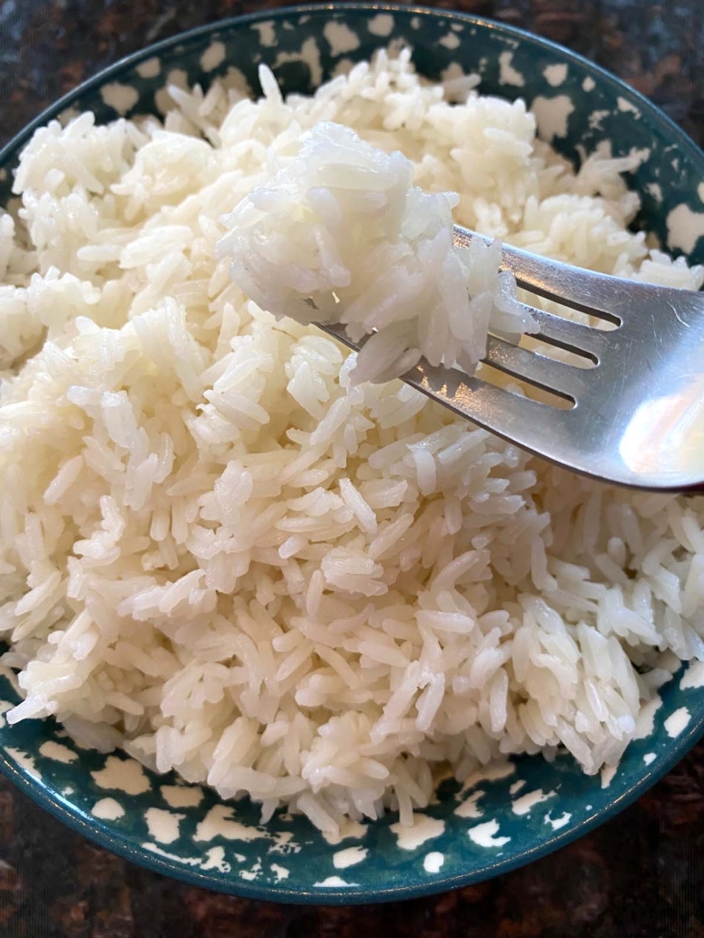 fork digging into jasmine rice