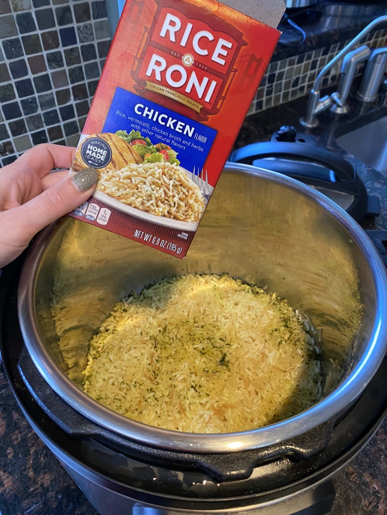 box of Rice-A-Roni in front of cooked rice