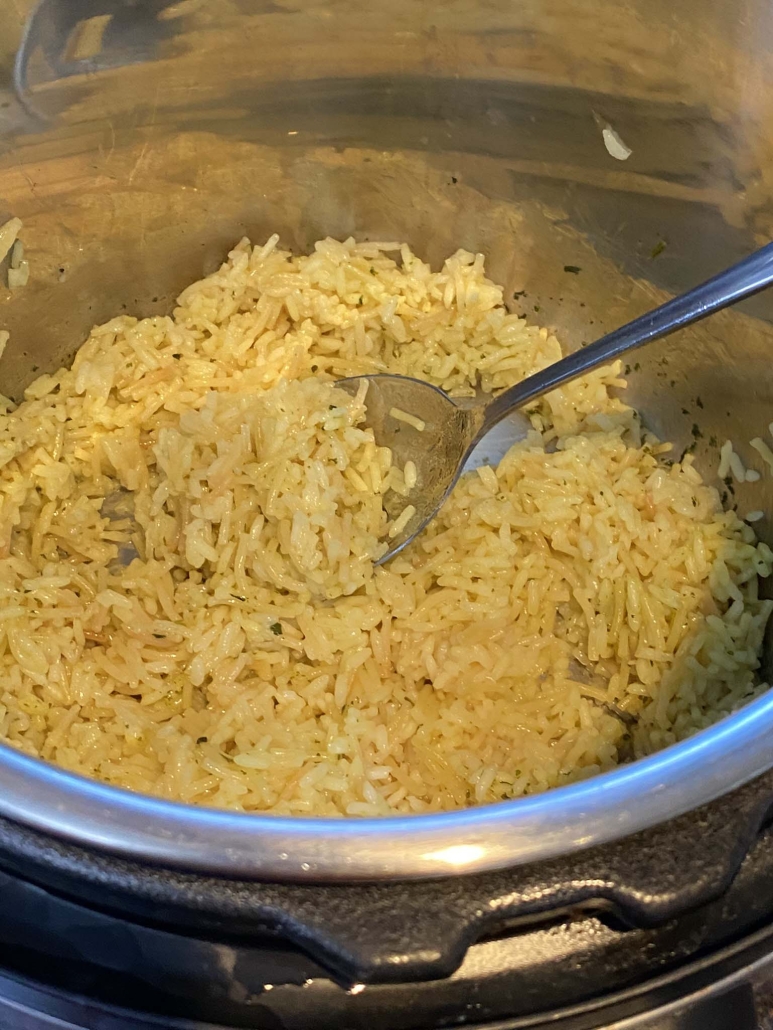 Instant Pot Rice-A-Roni with spoon scooping out