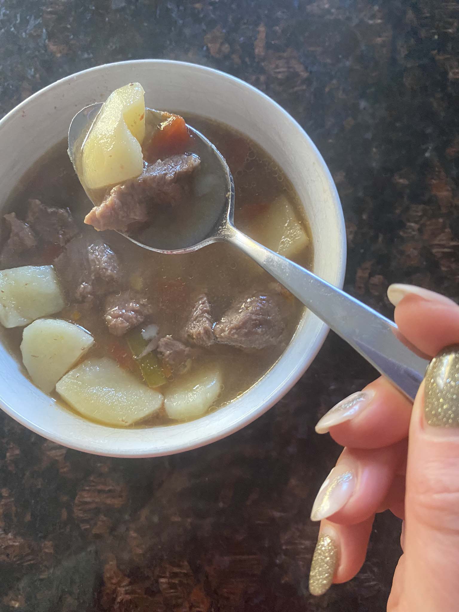 Vegetable beef soup in a bowl.