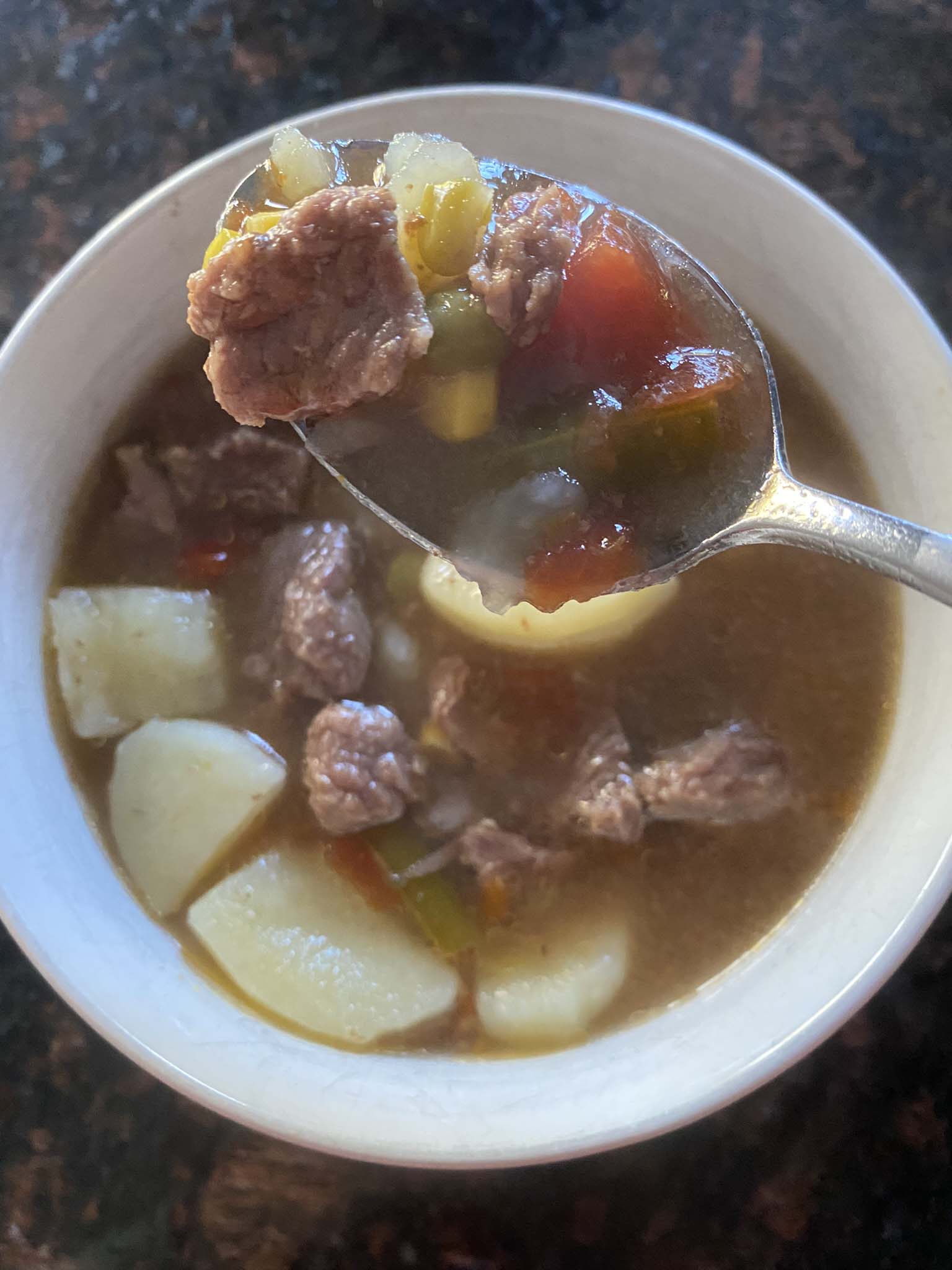 Vegetable beef soup in a bowl.