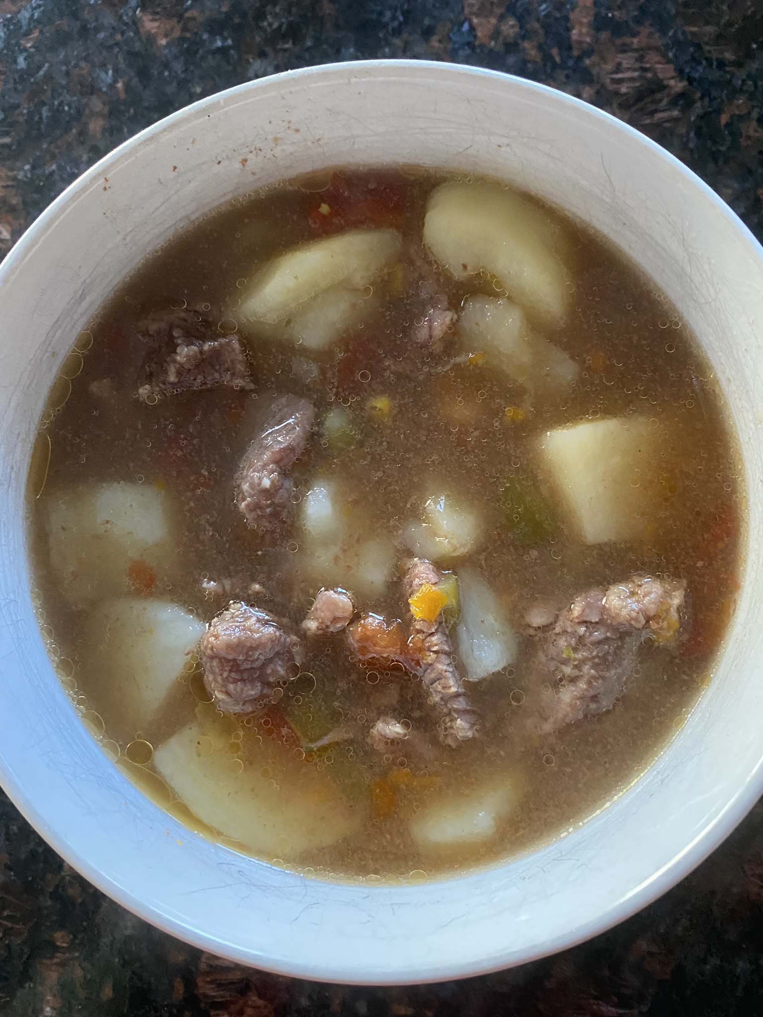 Vegetable beef soup in a bowl.